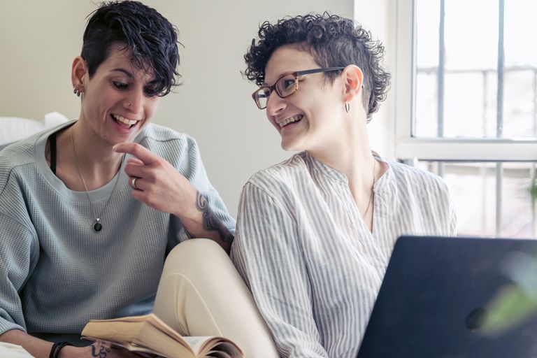 Couple reviewing retirement accounts and workplace benefits together